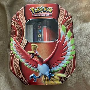 Pokémon card tin. Includes cards